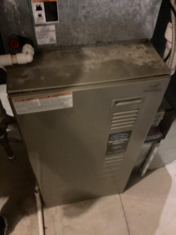 Provided comprehensive estimate for replacement of non-operational furnace system located in walk-out basement, with existing equipment exceeding 20 years of service life. Assessment included evaluation of current Carrier air handler installation with associated ductwork, PVC condensate drainage, and refrigerant line configuration. Additional estimate provided for humidifier replacement on secondary HVAC unit per customer request.