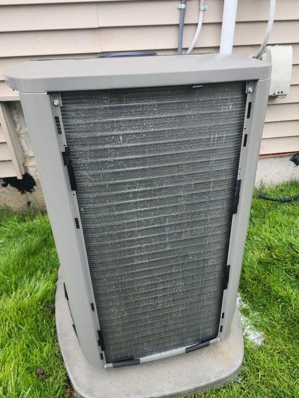 Completed scheduled maintenance on residential air conditioning system. Inspected outdoor condenser unit and noted moderate dust and debris accumulation on coil fins. Accessed indoor air handler components through service opening to verify proper operation of blower motor, electrical connections, and refrigerant lines. All wiring connections, capacitor, and control board showed normal condition. System operational upon completion of maintenance inspection.