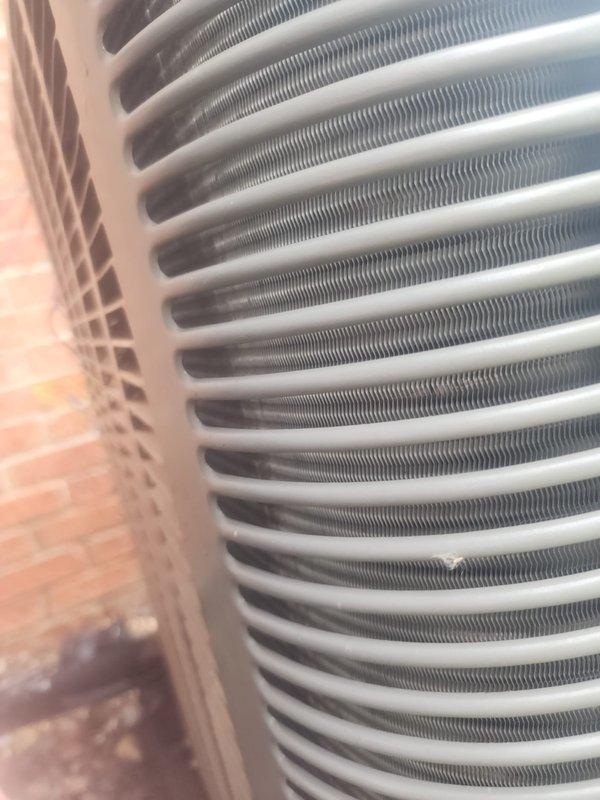 Completed comprehensive maintenance on air conditioning unit, furnace, humidifier, and hot water tank. Inspected outdoor AC unit including condenser coils, compressor assembly, refrigerant lines, and electrical connections—all components found in good operating condition with clean coils and proper system function. Customer enrolled in maintenance plan during visit.