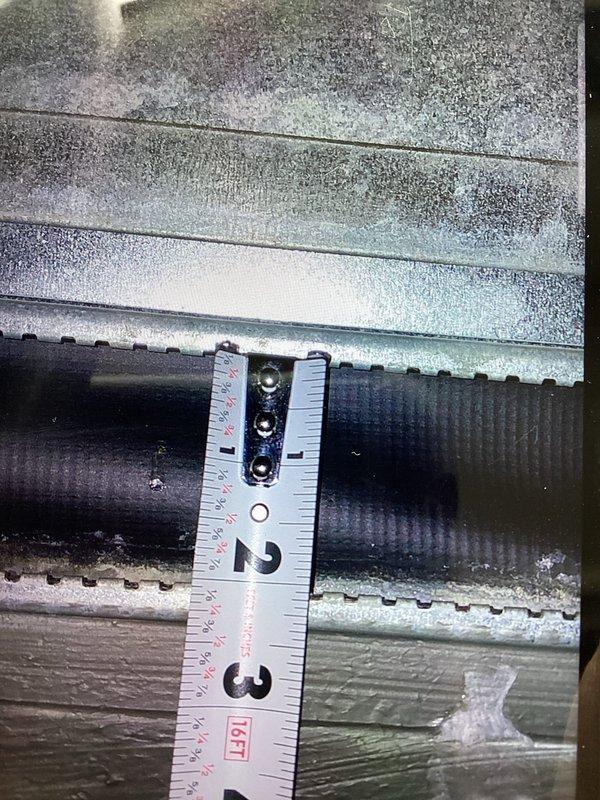 Responded to failed inspection recall to correct compressed canvas connector on furnace supply side. Adjusted and repositioned flexible duct connector to ensure proper clearance and compliance with code requirements. Documented corrections with photographs showing proper duct spacing and clearances for inspector review and approval.