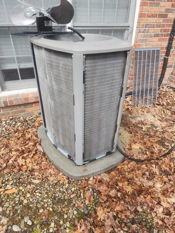 Completed scheduled maintenance on two residential air conditioning systems. Performed comprehensive inspection of outdoor condenser units, including examination of coil condition, electrical connections, and overall system operation. Documented equipment condition with photos showing accumulation of debris around exterior unit and moderate dust buildup on condenser coils requiring attention during routine service procedures.