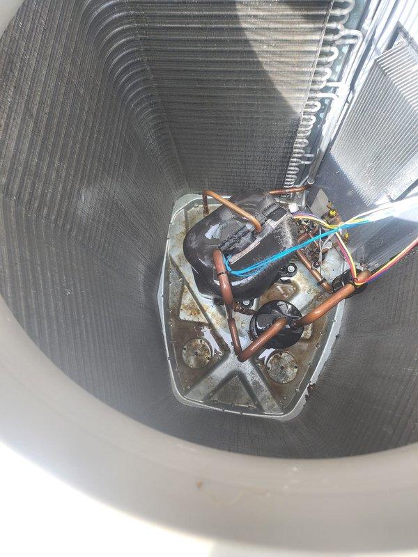 Completed scheduled maintenance on two residential air conditioning systems. Performed comprehensive inspection of outdoor condenser units, including examination of coil condition, electrical connections, and overall system operation. Documented equipment condition with photos showing accumulation of debris around exterior unit and moderate dust buildup on condenser coils requiring attention during routine service procedures.