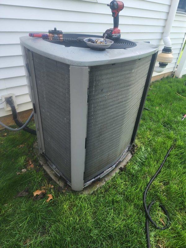 Completed comprehensive cooling season maintenance on residential air conditioning system. Performed detailed inspection of outdoor condenser unit including compressor, capacitor, electrical connections, and condenser coils. All components were evaluated for proper operation, connections were verified secure, and unit was confirmed to be functioning within normal parameters for continued reliable cooling performance.
