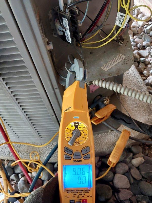 Performed comprehensive preventive maintenance inspection on commercial HVAC system under Worry Free Service Agreement. Conducted electrical diagnostics using calibrated multimeter, verifying system voltage readings at 90.0V and confirming proper electrical functionality across all circuits. Inspected capacitor assembly with multi-circuit wiring connections, air filtration components, contactor relay operation, and flexible ductwork connections. All system components found operating within manufacturer specifications with no deficiencies noted.