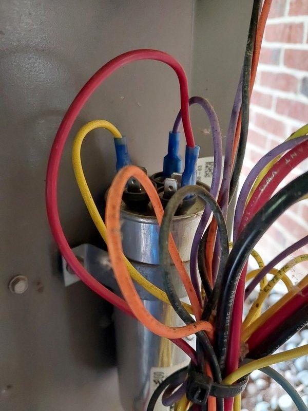 Performed comprehensive preventive maintenance inspection on commercial HVAC system under Worry Free Service Agreement. Conducted electrical diagnostics using calibrated multimeter, verifying system voltage readings at 90.0V and confirming proper electrical functionality across all circuits. Inspected capacitor assembly with multi-circuit wiring connections, air filtration components, contactor relay operation, and flexible ductwork connections. All system components found operating within manufacturer specifications with no deficiencies noted.