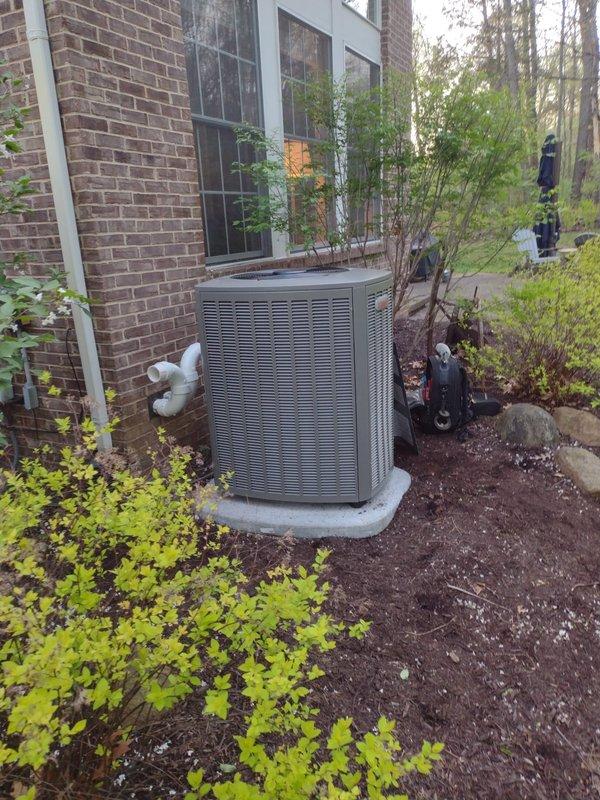 Completed full HVAC system installation including Lennox furnace, air conditioning condenser unit, S40 smart thermostat, whole-home humidifier, and 50-gallon water heater. The outdoor AC condenser was professionally positioned on a concrete pad against the building exterior with proper clearances maintained for optimal airflow and service access. All refrigerant lines were installed and connected per manufacturer specifications.

Inside the mechanical room, the new Lennox furnace was mounted and integrated with the existing ductwork infrastructure. Installed new supply and return duct connections with proper sealing to ensure maximum system efficiency. The S40 thermostat was wired and programmed to control both heating and cooling functions with smart home capabilities enabled.

Integrated a whole-home humidifier into the HVAC system to maintain optimal indoor humidity levels during heating season. All electrical connections were completed to code, including dedicated circuits for the 