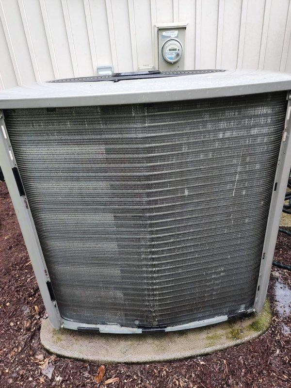 Completed comprehensive cooling system maintenance and tune-up on residential air conditioning unit. Performed standard preventive maintenance procedures including inspection of outdoor condenser unit, which showed accumulated debris between fins and weathering consistent with outdoor exposure. Cleaned condenser coils to restore optimal airflow and heat transfer efficiency. Inspected indoor evaporator coil assembly and accumulator component, noting rust staining on drain pan indicating historical moisture accumulation. Verified all refrigerant line connections, electrical wiring, and system components were secure and functioning properly. System tested and confirmed operational with no performance issues identified at time of service.