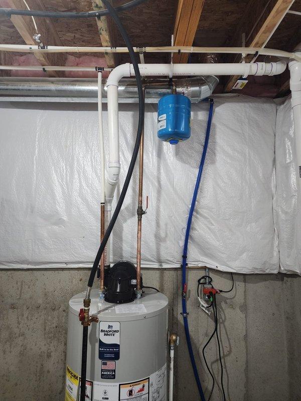Completed installation of a 50-gallon residential tanked water heater in basement utility area. Unit was properly positioned, secured, and connected to existing plumbing infrastructure including supply lines, discharge piping, and drainage systems. All connections were made to code specifications with appropriate pressure relief valve installation, thermal expansion accommodation, and proper venting. System was tested for functionality and leak-free operation upon completion.