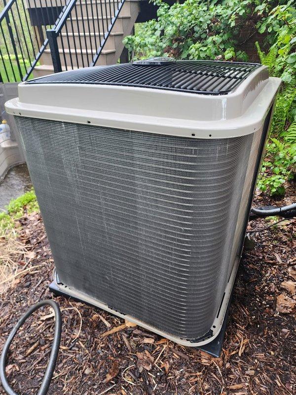 Completed routine air conditioning maintenance on residential split system. Inspected outdoor condenser unit, confirming proper placement on concrete pad with adequate clearance from landscaping and no visible damage or debris accumulation. Verified refrigerant line connections and electrical conduit integrity at exterior unit. Inspected indoor air handler components including emergency drain pan, condensate drainage system, and refrigerant line connections in mechanical space. All equipment operating within normal parameters with no immediate service needs identified.