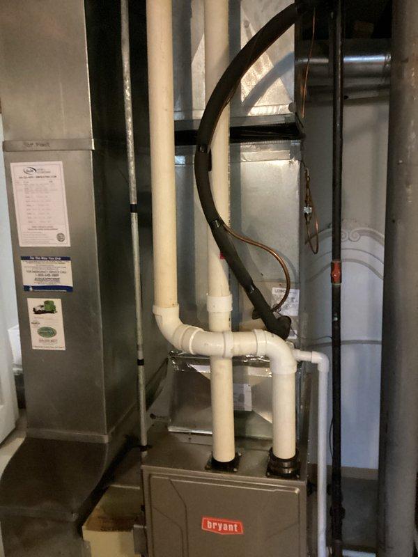Completed comprehensive estimate for replacement of two HVAC systems in residential property. Evaluated existing Bryant equipment, air handler unit, and associated ductwork including flexible metallic ducting, PVC drainage lines, and ventilation components in mechanical room. Documented current system configuration and provided replacement recommendations for dual-system installation to meet heating and cooling requirements.