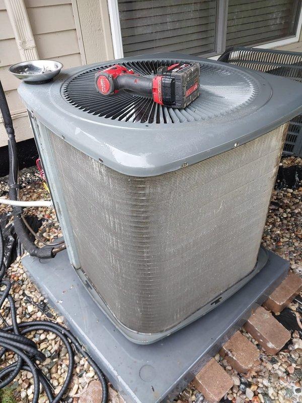 # HVAC Maintenance - Cooling System Service

Performed comprehensive preventive maintenance on residential air conditioning system. Accessed outdoor condenser unit and removed service panels to inspect internal components including compressor, refrigerant lines, capacitor, and electrical connections. Cleaned condenser compartment, removing accumulated dirt and debris from base pan and surrounding components. Verified proper operation of compressor and associated copper refrigerant tubing. Inspected electrical wiring and connections for signs of wear or damage. Confirmed capacitor condition and secure mounting of all internal components. Checked refrigerant line insulation and exterior conduit routing. Reassembled unit and verified system returned to normal operating condition upon completion of scheduled maintenance procedures.