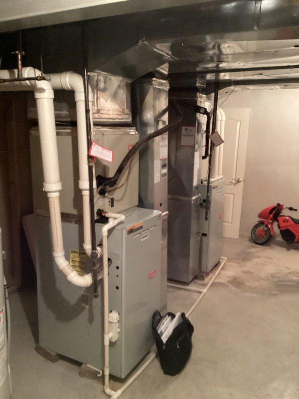 Completed comprehensive estimate for replacement of two residential furnace systems due to failed heat exchangers with rust-through damage on both units. Documented existing HVAC installation in basement mechanical room, including current furnace configurations, ductwork connections, PVC venting systems, and associated components. Photographed both furnace units showing advanced deterioration of heat exchangers requiring full system replacement rather than repair. Prepared multiple quote options for dual furnace replacement to address safety concerns and restore proper heating functionality to the residence.
