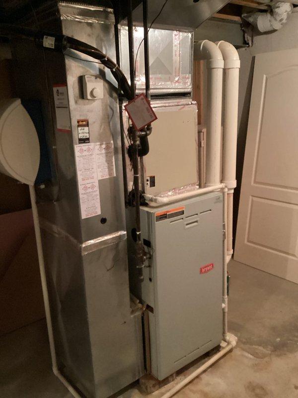 Completed comprehensive estimate for replacement of two residential furnace systems due to failed heat exchangers with rust-through damage on both units. Documented existing HVAC installation in basement mechanical room, including current furnace configurations, ductwork connections, PVC venting systems, and associated components. Photographed both furnace units showing advanced deterioration of heat exchangers requiring full system replacement rather than repair. Prepared multiple quote options for dual furnace replacement to address safety concerns and restore proper heating functionality to the residence.