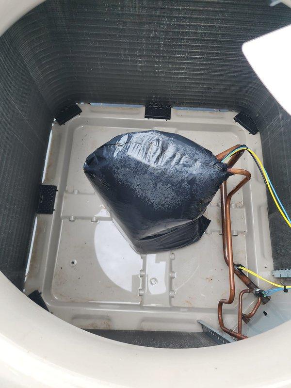Completed scheduled cooling system maintenance and tune-up on HVAC system. Performed comprehensive inspection of outdoor condenser unit, verifying proper airflow through coil fins and grille assembly. Unit showed normal environmental weathering with minor dirt accumulation on heat exchanger fins. Inspected indoor evaporator coil assembly and discovered significant frost buildup on coil surface, indicating potential airflow restriction or refrigerant charge issue. Examined refrigerant lines, electrical connections, and condensate drain pan for proper operation. Documented equipment condition with photos for maintenance records. System currently operational but frost accumulation requires monitoring or follow-up service to prevent efficiency loss and potential compressor damage.