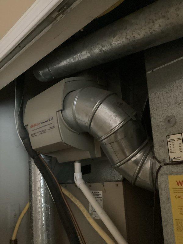 Provided estimate for replacement of 20-year-old furnace and air conditioning system due to oxygen sensor leak in furnace and refrigerant leak in AC unit, with both systems non-operational. Assessed existing natural gas furnace installation in basement utility area with complex ductwork configuration including galvanized metal ducts, flexible insulated ductwork, and PVC drainage components, and evaluated air conditioning system for complete replacement recommendation.