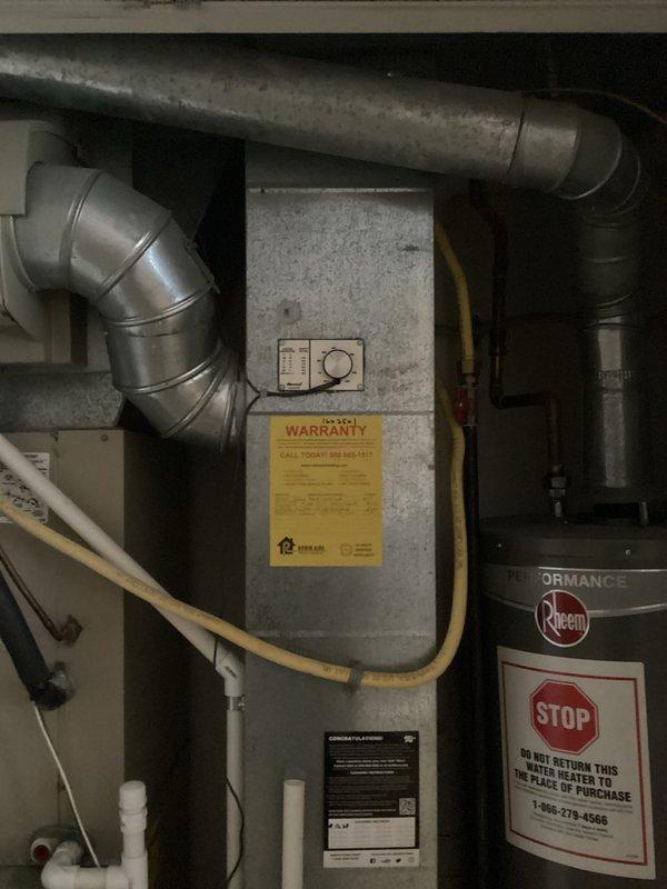 Provided estimate for replacement of 20-year-old furnace and air conditioning system due to oxygen sensor leak in furnace and refrigerant leak in AC unit, with both systems non-operational. Assessed existing natural gas furnace installation in basement utility area with complex ductwork configuration including galvanized metal ducts, flexible insulated ductwork, and PVC drainage components, and evaluated air conditioning system for complete replacement recommendation.