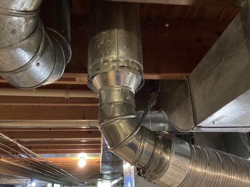 Successfully installed a 50-gallon Bradford White residential water heater in basement mechanical room. Removed existing unit and positioned new water heater in accordance with manufacturer specifications and local plumbing codes. Connected cold water supply line with brass shut-off valve and installed temperature and pressure relief valve with proper discharge piping. Established hot water distribution connections using copper piping with appropriate fittings and isolation valves. Verified all connections for leaks, tested TPR valve operation, and confirmed proper venting configuration. Unit was filled, purged of air, and brought up to operating temperature. System tested and verified functioning correctly with no leaks detected at any connection points.