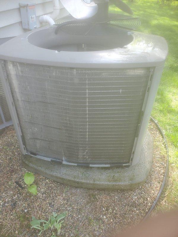 Completed preventative maintenance inspection on residential air conditioning system. Examined outdoor condenser unit, confirmed operational status of compressor and fan motor, and noted normal dirt accumulation on coil fins consistent with regular outdoor exposure. All refrigerant lines and electrical connections were inspected and found secure with no visible signs of damage or leakage.