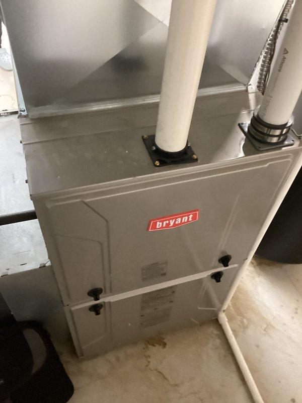 Conducted comprehensive system evaluation for non-operational air conditioning unit and assessed existing Bryant natural gas furnace and natural gas water heater for potential replacement. Documented current equipment conditions including furnace installation with PVC venting system, internal heat exchanger components, and overall mechanical room configuration to provide detailed replacement options and recommendations for full HVAC system upgrade.