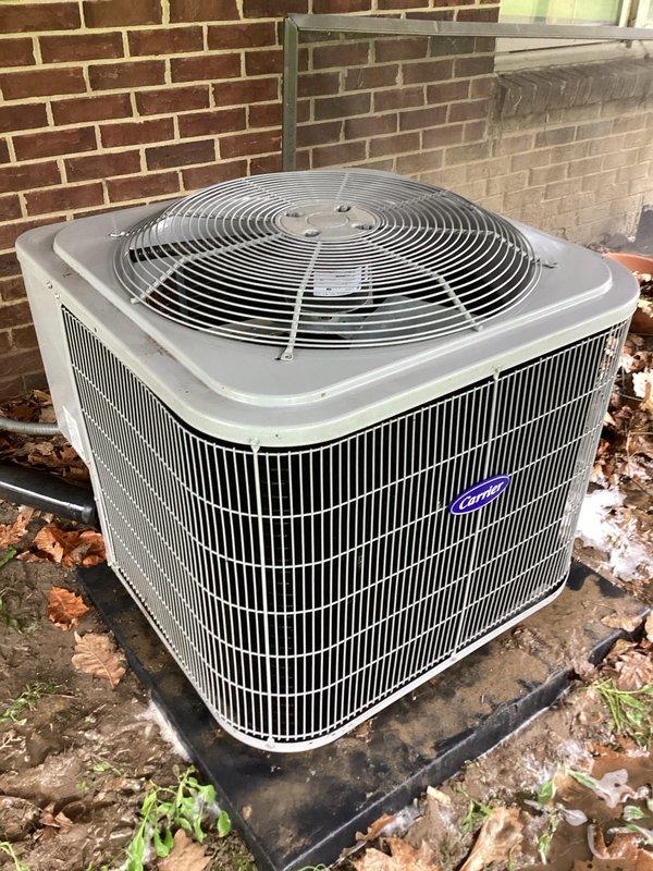 Performed routine AC maintenance on Carrier outdoor condenser unit, inspecting compressor, refrigerant lines, and electrical connections. Documented system condition with exterior unit showing clean coils and intact components, and interior compressor properly seated in drain pan with copper lines showing normal oxidation. Retrieved space heaters from property as requested by customer.