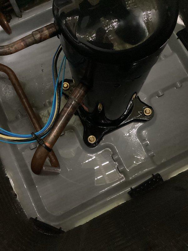 Performed routine AC maintenance on Carrier outdoor condenser unit, inspecting compressor, refrigerant lines, and electrical connections. Documented system condition with exterior unit showing clean coils and intact components, and interior compressor properly seated in drain pan with copper lines showing normal oxidation. Retrieved space heaters from property as requested by customer.
