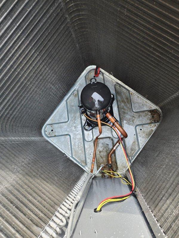 Completed annual tune-up maintenance on 3-year-old residential air conditioning system and furnace. Performed comprehensive inspection of outdoor condenser unit, noting frost accumulation on exterior casing which indicated active cooling cycle during service. Inspected refrigerant lines, copper tubing connections, and insulation integrity at condenser base. Examined indoor air handler components including blower motor assembly, electrical connections, and condensate drainage system. Verified proper operation of all wiring connections (power and control circuits) and confirmed mounting hardware security. Both heating and cooling systems tested and found operating within normal parameters for equipment age.