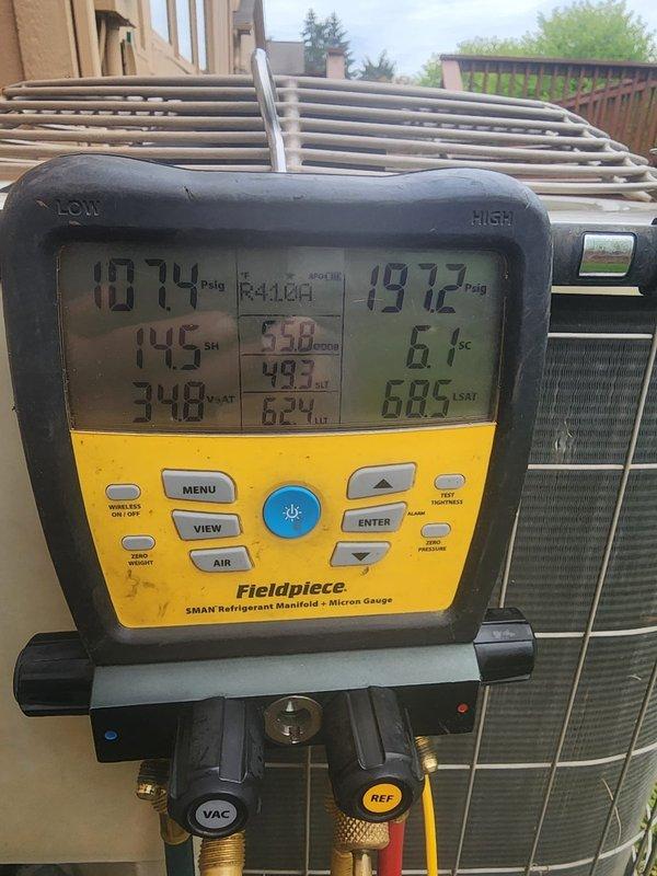 Performed comprehensive air conditioning maintenance service on outdoor condensing unit. Connected Fieldpiece SMAN digital manifold gauges to measure system pressures and temperatures, recording superheat and subcooling values to verify proper refrigerant charge and system performance. All operating parameters found within manufacturer specifications, confirming optimal cooling efficiency and system operation.
