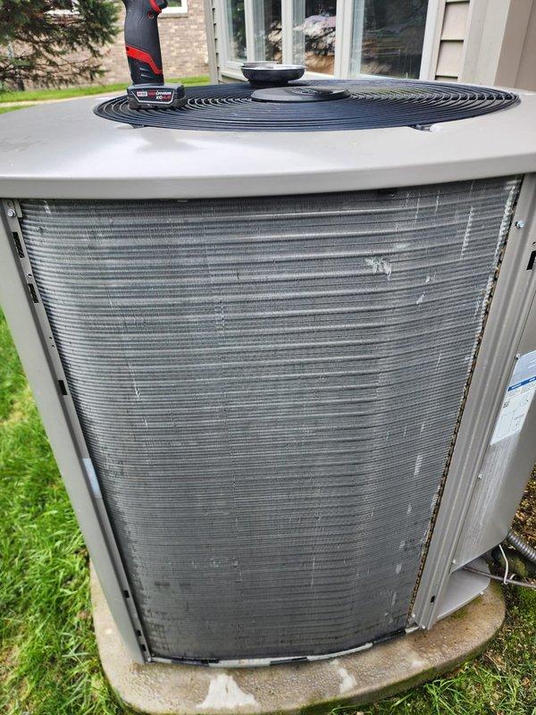Completed prepaid HVAC maintenance tune-up on a residential cooling system. Performed comprehensive inspection of indoor evaporator coil assembly, refrigerant lines, condensate drain pan, and electrical connections within the air handler. Inspected outdoor condenser unit including condenser coil fins, fan assembly, and overall unit operation. System was found to be operating properly with no deficiencies noted. All components inspected and confirmed to be in serviceable condition. Photographic documentation captured for maintenance records.