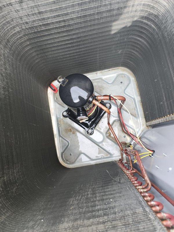 Completed comprehensive cooling system maintenance and tune-up on outdoor air conditioning unit. Removed exterior casing to access and inspect condenser coils, performed thorough cleaning of coil assembly, and verified proper operation of compressor and electrical connections. System tested and confirmed operational with all components functioning within normal parameters.