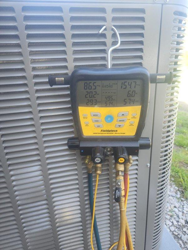 Performed seasonal AC startup and system diagnostics on outdoor condensing unit. Connected digital manifold gauges to measure refrigerant pressures and temperatures, verifying proper system operation and refrigerant charge levels. All readings were within normal operating parameters, confirming the unit is ready for the cooling season.