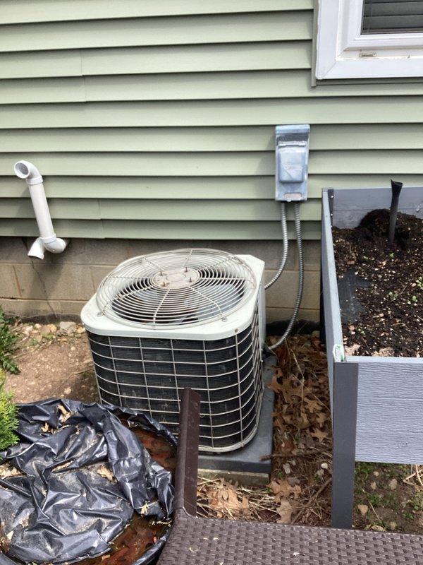 Completed comprehensive HVAC replacement estimate for residential property with existing system over 20 years old. Assessed outdoor condensing unit with protective cage enclosure, electrical disconnect box, and condensate drainage system on exterior wall with vinyl siding. Evaluated main electrical panel capacity and circuit configuration to ensure compatibility with new high-efficiency equipment and discussed available energy efficiency rebate programs with homeowner for potential system upgrades.