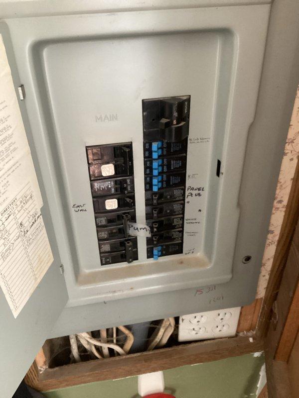 Completed comprehensive HVAC replacement estimate for residential property with existing system over 20 years old. Assessed outdoor condensing unit with protective cage enclosure, electrical disconnect box, and condensate drainage system on exterior wall with vinyl siding. Evaluated main electrical panel capacity and circuit configuration to ensure compatibility with new high-efficiency equipment and discussed available energy efficiency rebate programs with homeowner for potential system upgrades.