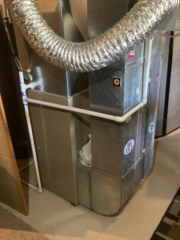 Provided comprehensive estimate for complete HVAC system replacement including both air conditioning unit and natural gas furnace, with existing 25-year-old equipment located in basement mechanical room. Current air conditioning system is non-operational while furnace remains functional. Assessed existing installation configuration including ductwork connections, condensate drainage system, and equipment positioning to determine optimal replacement specifications and installation requirements.
