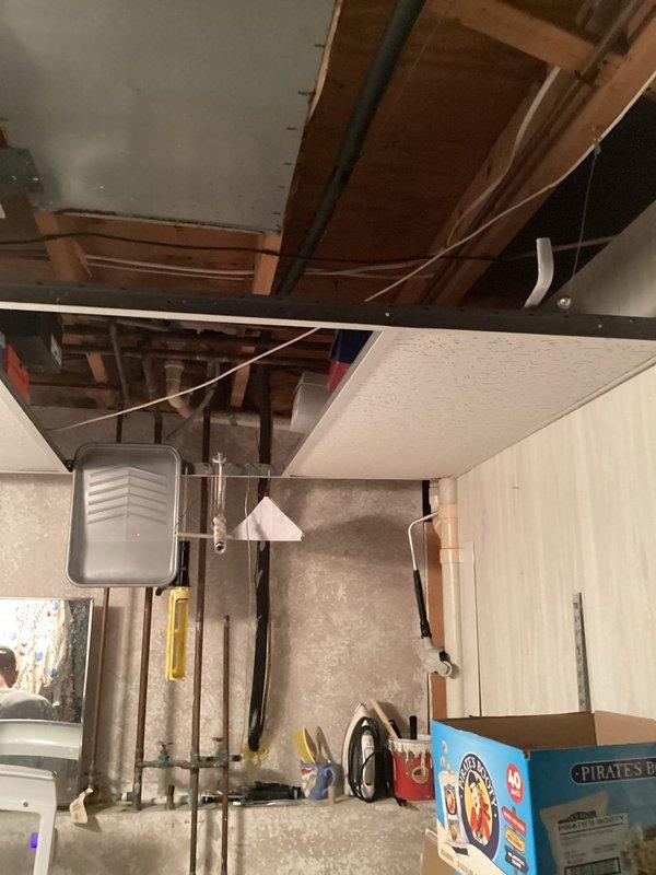 Provided estimate for complete central air conditioning system replacement including new outdoor condensing unit and evaporator coil installation on existing furnace. Property currently has no evaporator coil installed and previous AC system has been non-operational since before 2013 with unknown system age. Assessed basement mechanical room location and existing 220V electrical service, noting potential electrical upgrade requirements for new equipment installation. Outdoor unit placement evaluated for backyard location with consideration for proper clearances and service access.