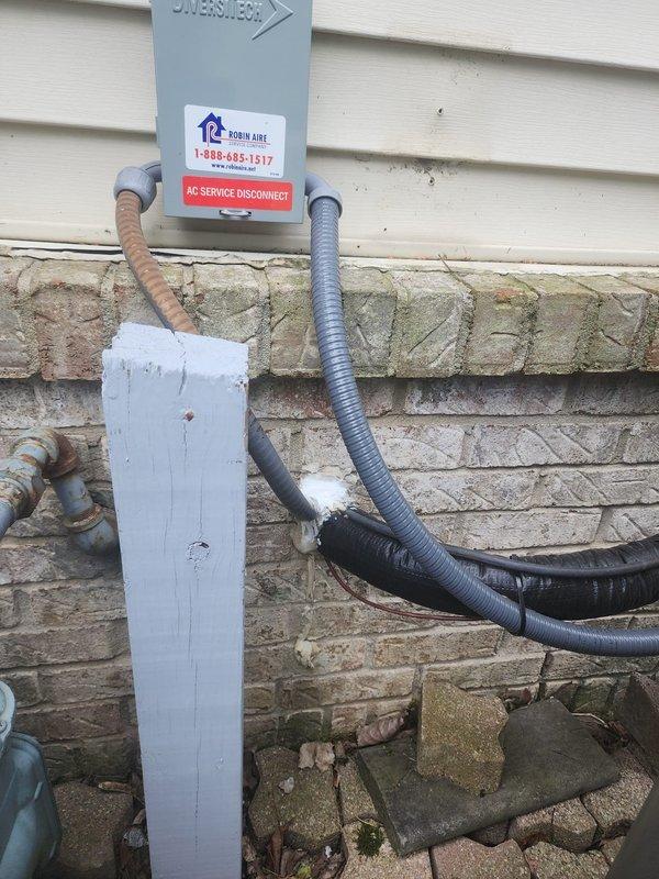 Completed callback service to finish installation detailing on recently installed Lennox HVAC system. Applied weather-resistant caulking around exterior wall penetrations and access points where refrigerant lines and electrical conduits enter the building to ensure proper sealing and weatherproofing. Verified all exterior components including AC disconnect box, line set insulation, and conduit routing were properly secured and protected against the elements.