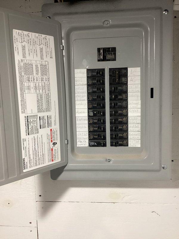 Conducted site assessment for air conditioning system installation at residential property currently equipped with furnace only. Evaluated existing electrical panel capacity and outdoor placement options for condensing unit installation. Documented electrical infrastructure and exterior wall conditions to prepare comprehensive equipment replacement estimate.