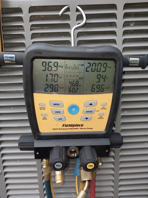 # HVAC Service Completed

Responded to no cooling complaint on aging residential air conditioning system. Upon arrival, performed comprehensive system diagnostics to identify root cause of failure.

Inspected electrical control panel and found failed contactor preventing compressor operation. Replaced defective contactor with new unit, ensuring all electrical connections were properly secured and torqued to manufacturer specifications. Verified proper wire routing and confirmed all safety devices were functioning correctly.

Conducted leak detection procedures due to system age and potential refrigerant loss. Added leak sealer with UV dye to refrigerant circuit to seal minor leaks and enable future leak detection if needed. Connected refrigerant manifold gauges to measure system pressures and verify proper charge levels. Monitored R-410A refrigerant pressures, superheat, and subcool readings using digital manifold gauge set.

System pressures stabilized at 96.9 psig low side and 200.9 