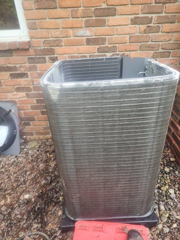 Completed AC maintenance tune-up on residential split system. Inspected outdoor condenser unit, verified proper operation of compressor and fan motor, checked refrigerant levels, and examined condensate drain pump assembly in collection pan. All components found operating within normal parameters; system ready for cooling season.