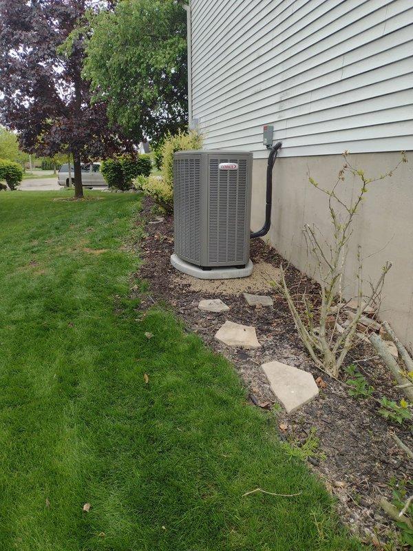 Completed full HVAC system installation including Lennox furnace, air conditioner, humidifier, and S40 thermostat. Installed outdoor condensing unit on concrete pad with proper refrigerant line routing along exterior wall, configured PVC venting system through siding for furnace exhaust and intake, and commissioned entire system to manufacturer specifications.