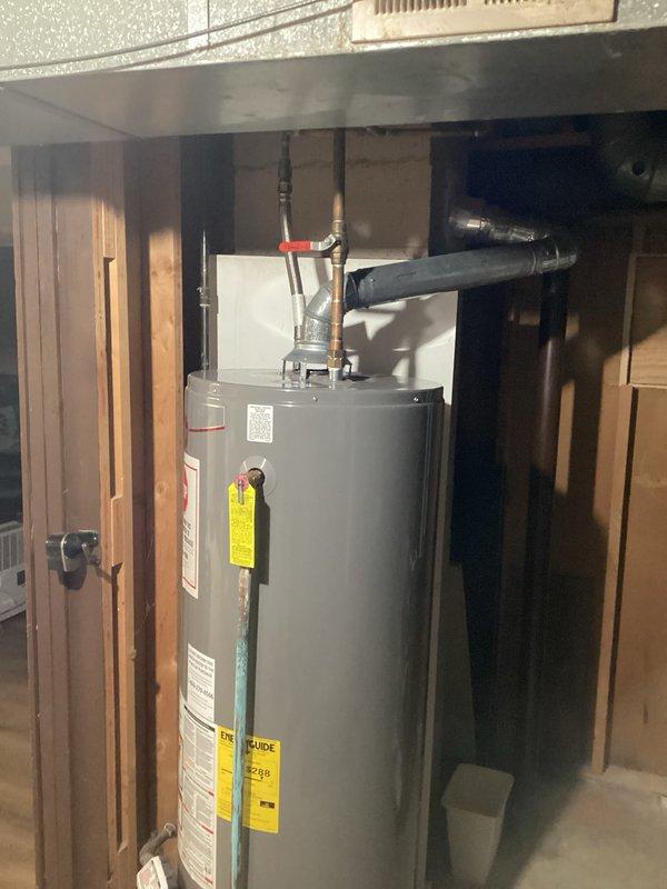 Conducted on-site assessment and provided estimate for 50-gallon water heater replacement serving well water system. Evaluated existing water heater installation in basement utility area, documented current unit specifications, plumbing connections including copper supply lines with shut-off valves, pressure relief valve configuration, and venting arrangement for proper sizing and code compliance requirements.