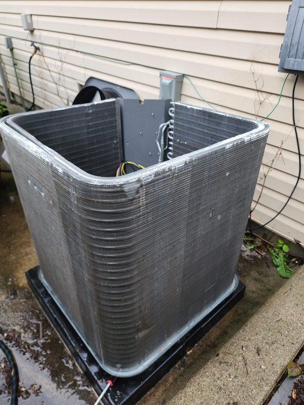 Completed scheduled HVAC maintenance on both air conditioning and furnace systems during a combined service appointment. Inspected indoor evaporator coil assembly and blower motor components, documenting condition of copper refrigerant lines, electrical connections, and mounting hardware within the air handler cabinet. Performed exterior condenser unit inspection, verifying proper operation and assessing coil condition, refrigerant line connections, and overall equipment status on the outdoor unit positioned on concrete pad.
