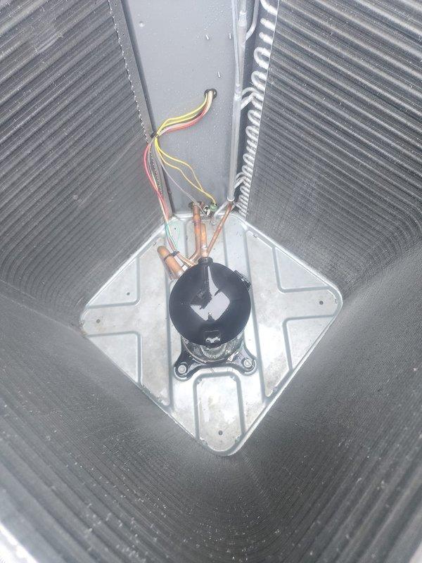 Performed routine maintenance on residential split-system air conditioning unit. Inspected condensing unit exterior, verified proper placement on composite pad, and examined refrigerant line connections at compressor. Checked electrical connections and wiring integrity within air handler cabinet. Unit operating within normal parameters with no immediate service needs identified.
