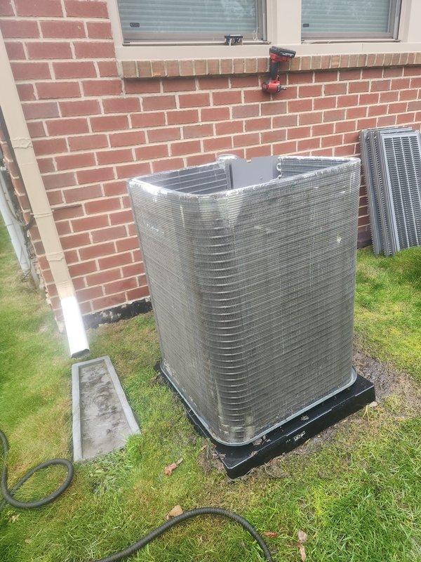 Performed routine maintenance on residential split-system air conditioning unit. Inspected condensing unit exterior, verified proper placement on composite pad, and examined refrigerant line connections at compressor. Checked electrical connections and wiring integrity within air handler cabinet. Unit operating within normal parameters with no immediate service needs identified.