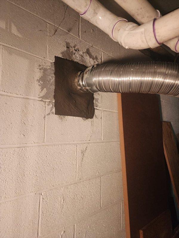 Completed installation of chimney liner system for HVAC equipment. Extended 4" hard pipe through chimney structure and installed new metallic chimney cap with flue pipe penetration on brick chimney. Installed 4x6 IVC liner for water heater venting through basement wall penetration, securing flexible aluminum ductwork with proper mounting hardware and sealing all wall openings with appropriate materials to ensure code-compliant installation and proper draft operation.