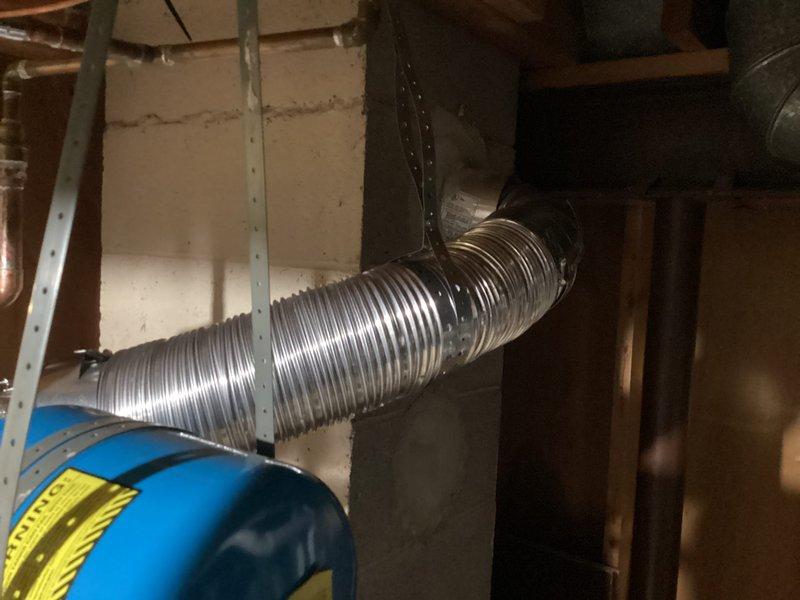 Completed installation of a 50-gallon tanked water heater in basement utility area. Unit was properly positioned, connected to existing plumbing lines, and integrated with HVAC system components including ductwork and ventilation. All connections were tested and verified operational upon completion.