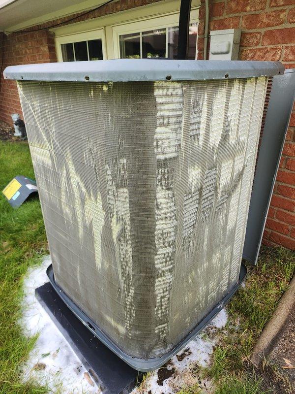 Completed comprehensive cooling system maintenance and tune-up on residential HVAC unit. System was found operational upon arrival. Performed standard preventive maintenance procedures including inspection of compressor, refrigerant lines, and electrical components within the condensing unit. Verified proper operation of pressure switches and controls. Cleaned and inspected outdoor condenser unit, noting weathering and environmental staining on exterior panels consistent with normal outdoor exposure. All mechanical components functioning within normal parameters, and system left in proper working condition.