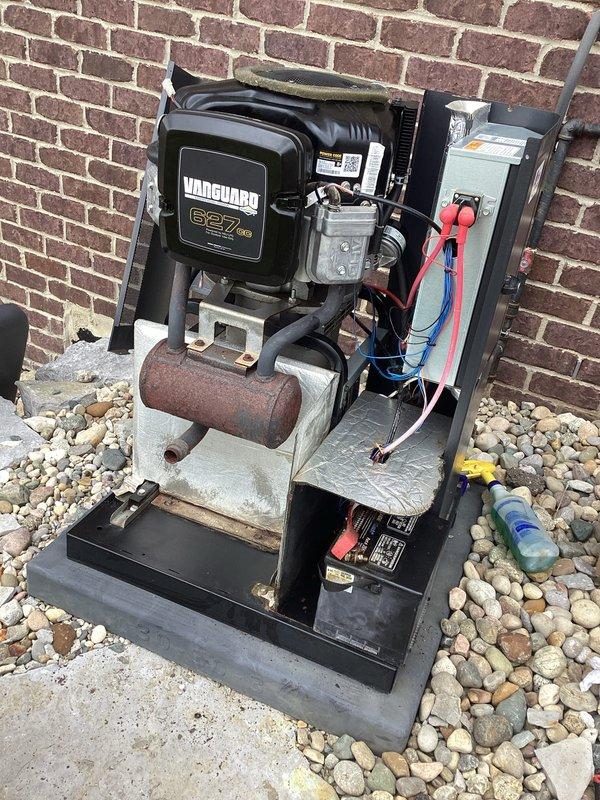 Performed scheduled maintenance on residential standby generator system. Replaced two corroded chrome-plated spring-loaded fasteners that secure critical components to the unit housing. Addressed significant rust and corrosion on cylindrical exhaust component, which showed heavy oxidation and deterioration affecting system integrity. Inspected electrical disconnect box, verified wire connections, and confirmed proper operation of all mechanical systems. Cleaned debris from unit base and surrounding area to ensure adequate ventilation and prevent future corrosion issues.