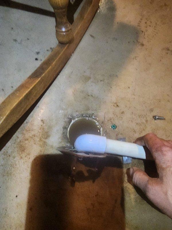 Responded to service call for furnace condensate drain leak. Upon inspection, found condensate drain line discharging water onto basement floor near floor drain. Condensate drainage system was not properly routed into the floor drain, causing water accumulation on concrete surface around drain area. Repositioned and secured condensate line to ensure proper drainage directly into floor drain opening. Verified condensate flow and confirmed no further leakage onto floor. System operating properly with condensate now draining correctly.