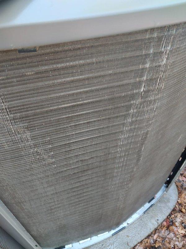 Completed comprehensive cooling season maintenance on residential air conditioning system per Worry Free Service Agreement protocol. Inspected exterior condenser unit, noting moderate dust and debris accumulation on heat exchanger coil fins requiring attention for optimal heat transfer efficiency. Accessed top panel to examine internal components including refrigerant lines, electrical connections, and blower motor assembly, verifying all connections secure and system operating within normal parameters.