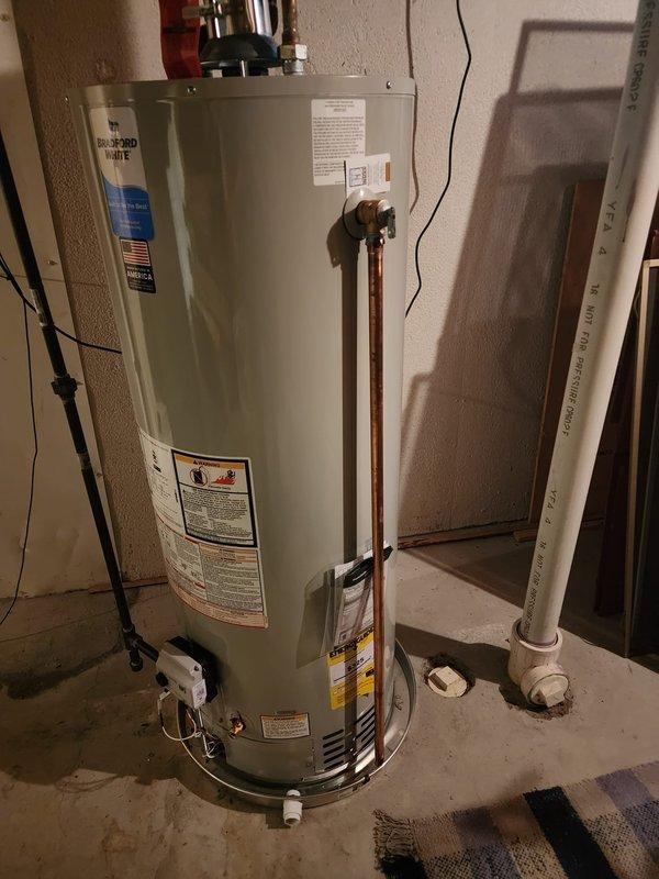 Completed callback service to address relief valve discharge piping on previously installed 50-gallon Bradford White water heater. Replaced existing discharge piping with code-compliant materials to meet 2015 Michigan Residential Code Chapter 28 requirements. Verified all plumbing connections, gas line assembly, and proper drainage pan installation, documenting completed work with photographs per service protocol.